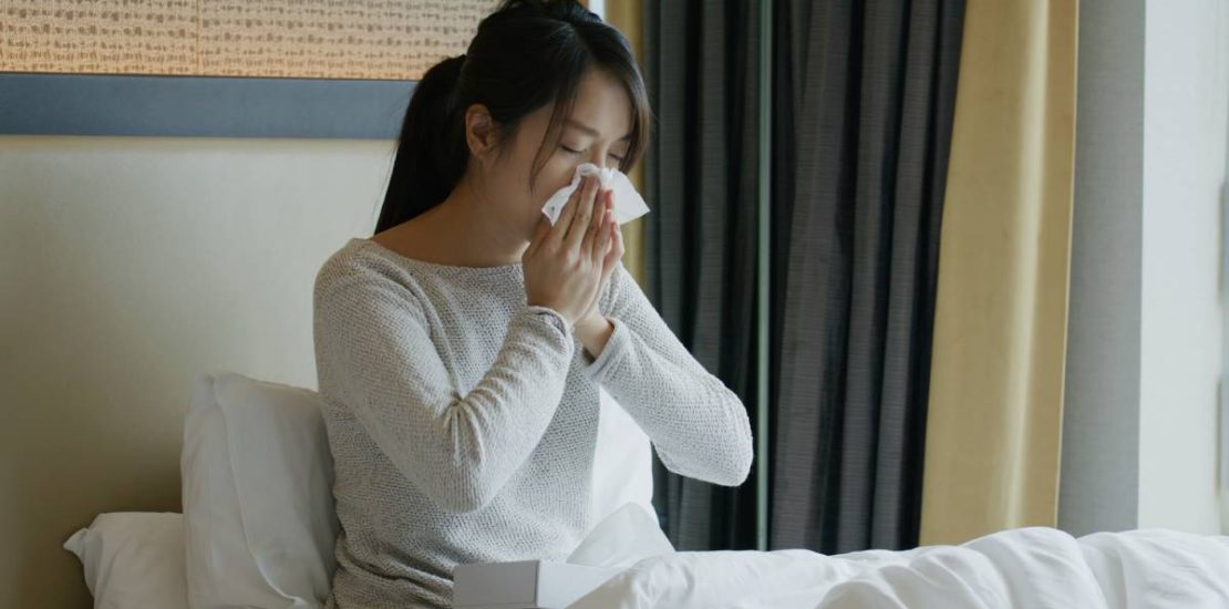 Woman get sick and sneeze on bed
