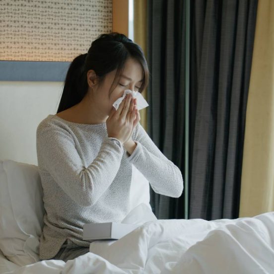 Woman get sick and sneeze on bed
